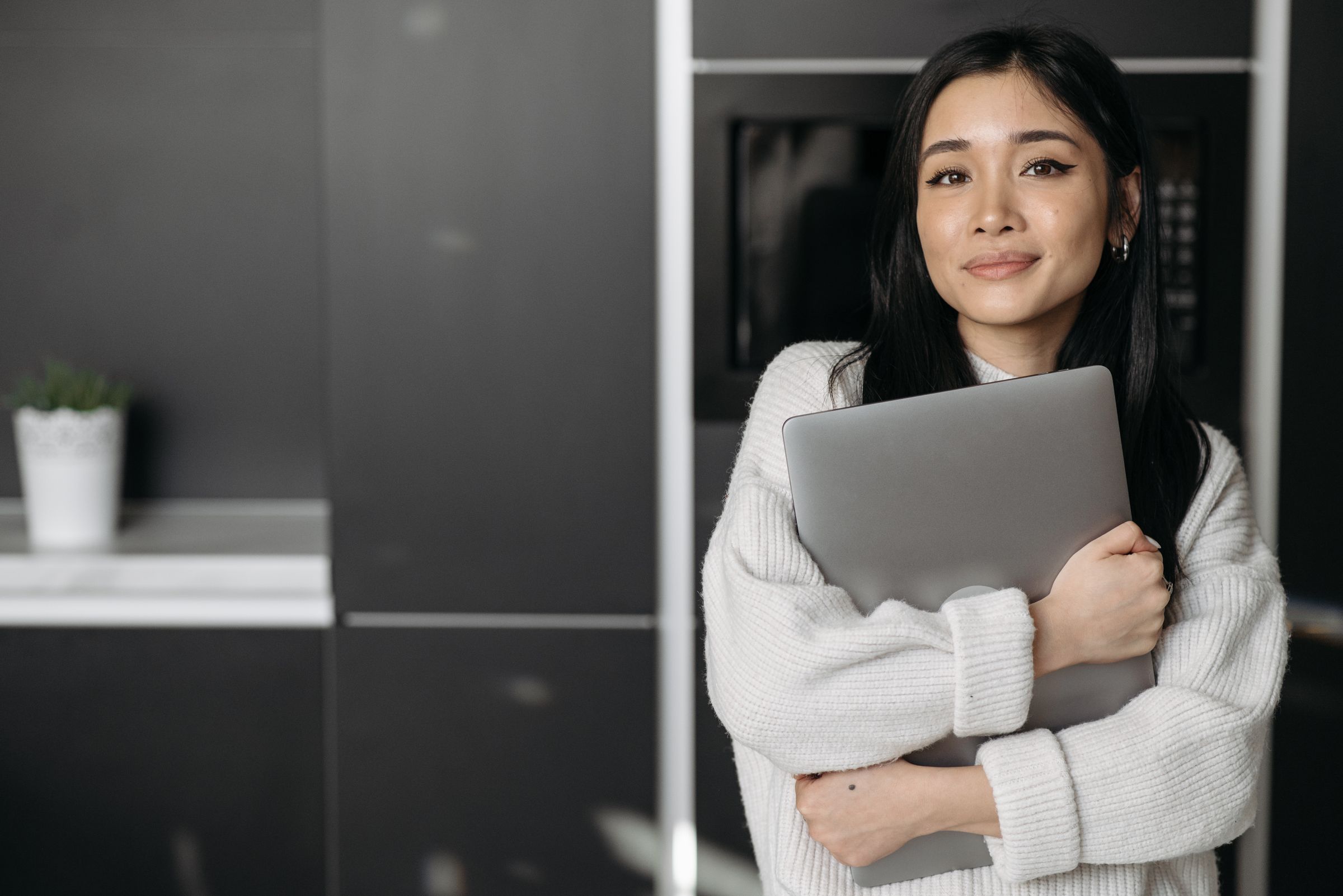 Customer holding a laptop.